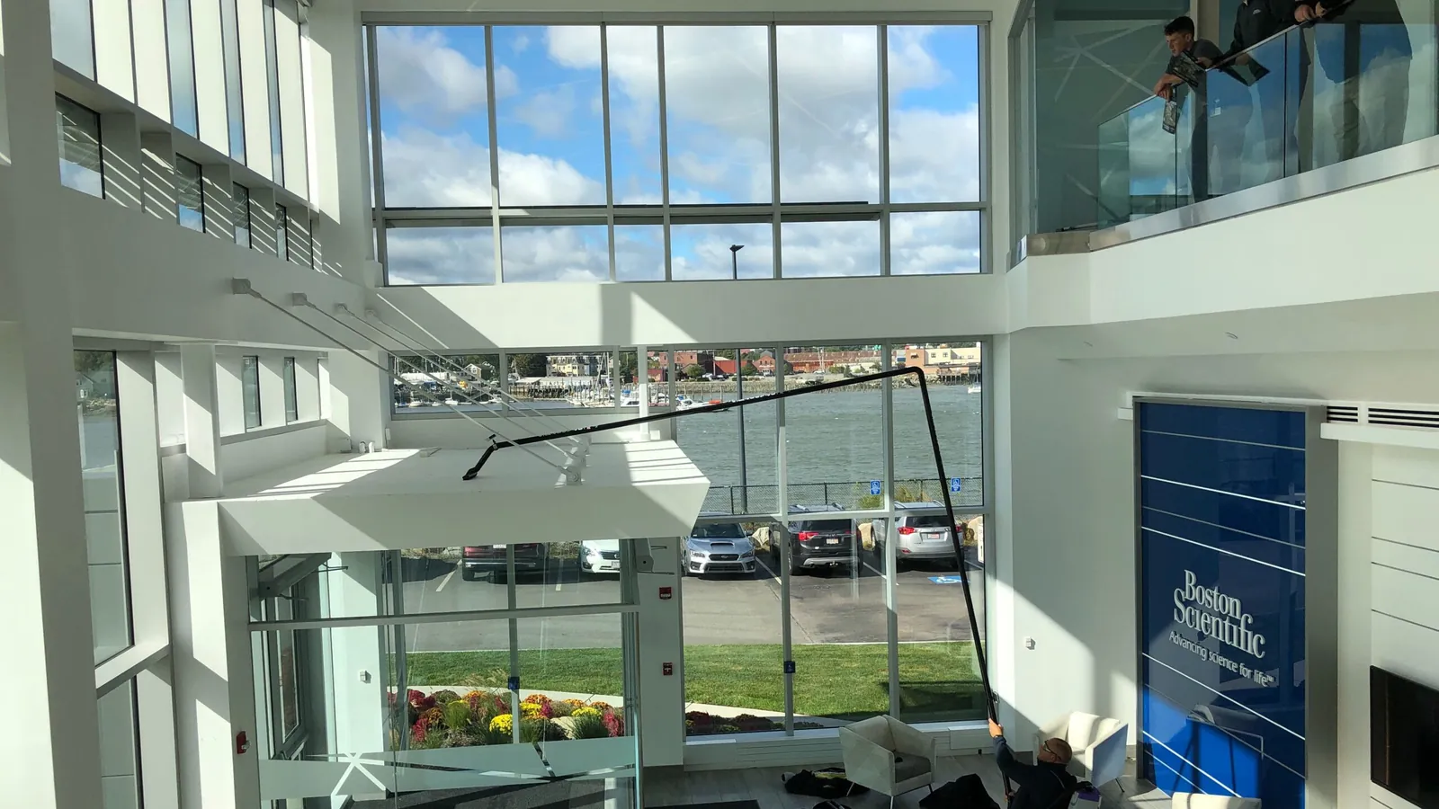 High-level cleaning beneath a glazed atrium roof from the floor, the ground-based method used for museum cleaning